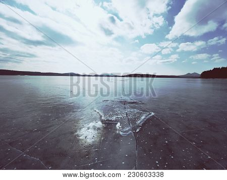 Big Piece Of Ice With Abstract Cracks Inside. Icicle Block Indetail With Frozen Bubbles And Rich Str