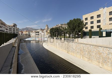 Orihuela, Spain: February 26, 2018: Shield Of The Orihuela Next To The River Segura, In The Province