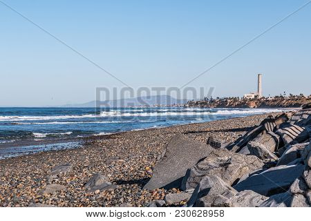 South Carlsbad State Beach In San Diego, California, With A Power Station Tower And Mountain Range I