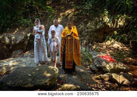 KOH CHANG, THAILAND - MAR 10, 2018: During Christian sacrament of spiritual birth - Baptism. There are currently 10 Orthodox parishes in Thailand, Orthodoxy is practiced by 0.002% of population.