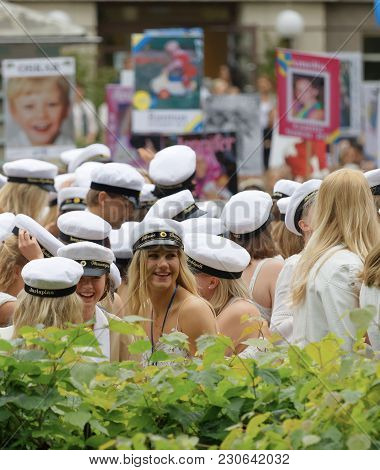 Stockholm, Sweden - Jun 13, 2017: Smiling Students Wearing White Graduation Caps After Graduation At