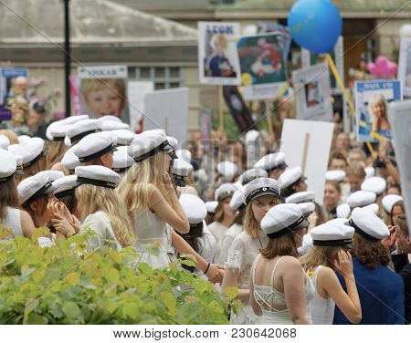Stockholm, Sweden - Jun 13, 2017: Smiling Students Wearing White Graduation Caps After Graduation At