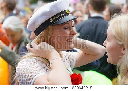 Stockholm, Sweden - Jun 13, 2017: Smiling Swedish Student Girl Wearing White Graduation Cap After Gr