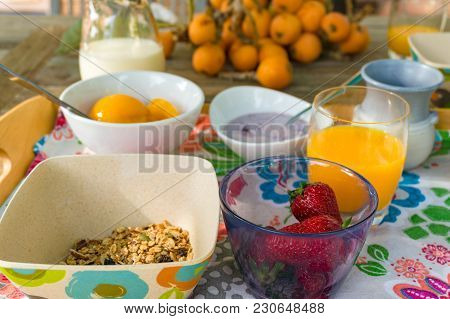 Close Up Of Healthy Breakfast With Oats, Granola And Fresh Strawberries