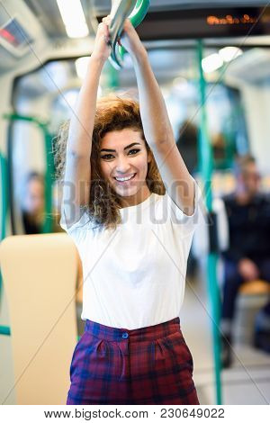 Smiling Arab Woman Inside Subway Train