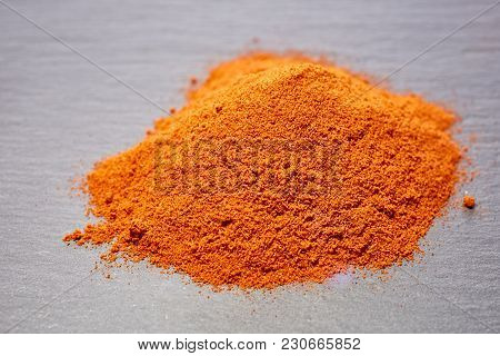 Red Ground Paprika Isolated On Light Grey Background, Shallow Depth Of Field, Top View, Close-up, Ma