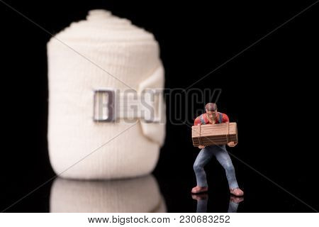 Bandage Used For Injuries During Work, Leisure Time Or In Housework, Isolated On Glossy Black Backgr
