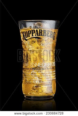 London, Uk - March 10, 2018 : Cold Glass Of Kopparberg Premium Cider  On Black Background.
