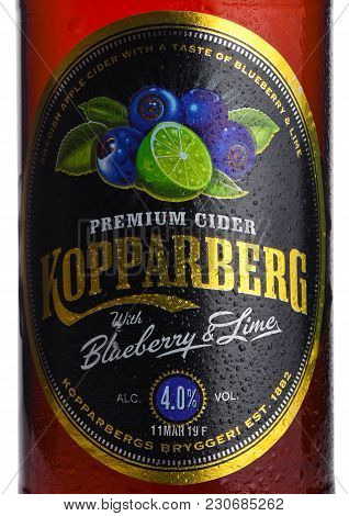London, Uk - March 10, 2018 : Cold Bottle Label Of Kopparberg Premium Cider With Blueberry And Lime 