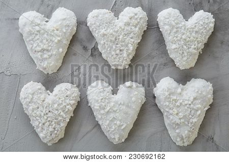 Sweet Crunchy Coconat Heart-shaped Biscuits Arranged In Pattern On Light Textured Background, Top Vi