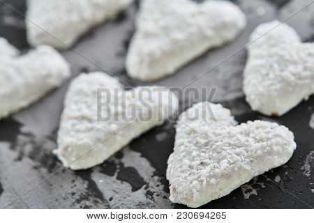 Sweet Crunchy Coconat Heart-shaped Biscuits Arranged In Pattern On Light Textured Background, Top Vi