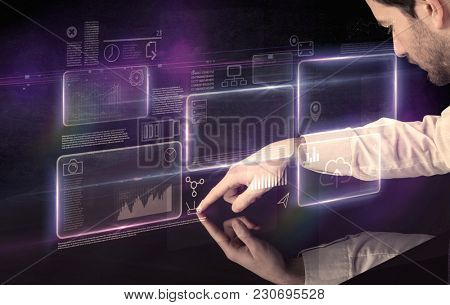 Male hands touching interactive table with purple cloudspace graphic on it 