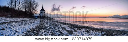 Beautiful Colorful Sunrise And Frozen Lake Liptovska Mara, Slovakia. Winter And Pebble Beach.