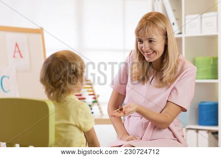 Child Boy Talking With Psychologist. Preschool Education.
