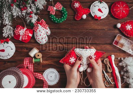 Felt Christmas Decorations On The Wooden Table - Woman Is Preparing For Handmade