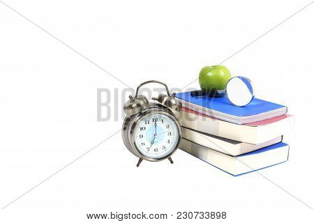 Books , Green Apple , Magnifying Glass And Traditional Wind-up (keywound) , Spring-driven Alarm Cloc