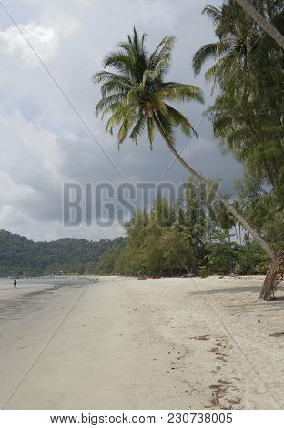 Ko Kut,thailand- February 25,2018: People Sunbathe And Swim At The Beach Paradise Of Coconut Island