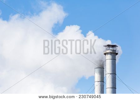 The Smoke From The Chimneys Of The Chp. Pollution Of The Environment. Environmental Disaster. Blue S