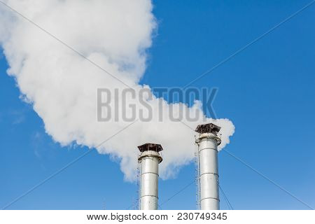 The Smoke From The Chimneys Of The Chp. Pollution Of The Environment. Environmental Disaster. Blue S
