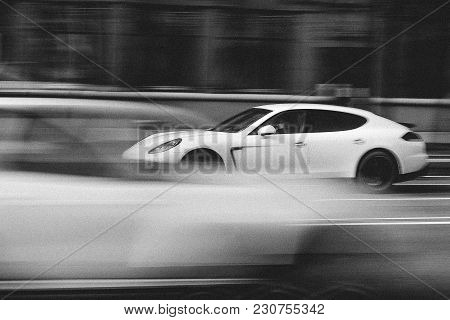 Minsk, Belarus - April 15, 2017: White Porsche Panamera In Motion At Intensive Traffic On Independen