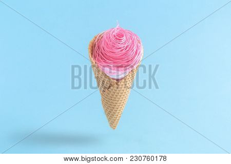 Ice Cream Made Of Colorful Strings In Cone On Blue Pastel Background Minimalistic Concept.