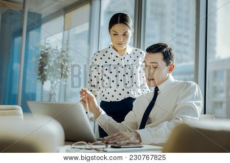 Searching For Appraisal. Pleasant Young Man Showing His Female Boss The Presentation Of His New Busi