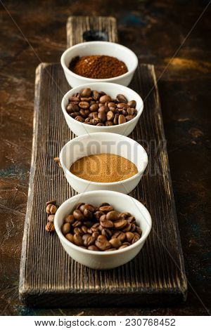 Set Of Coffee Beans, Ground Coffee And Instant Coffee In White Bowls