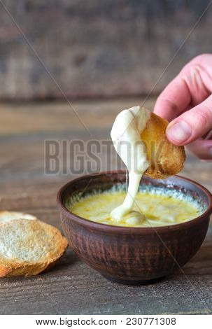 Bowl Of Cheese Dip With Toasts