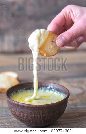 Bowl Of Cheese Dip With Toasts