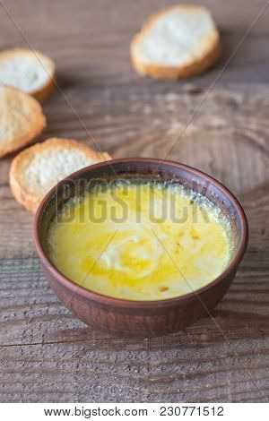 Bowl Of Cheese Dip With Toasts