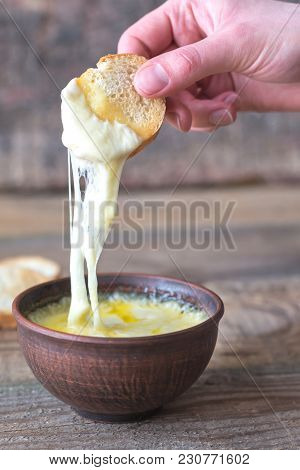 Bowl Of Cheese Dip With Toasts