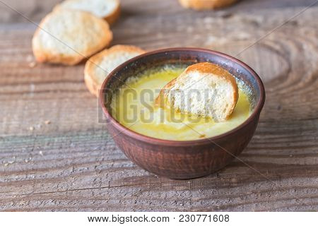 Bowl Of Cheese Dip With Toasts