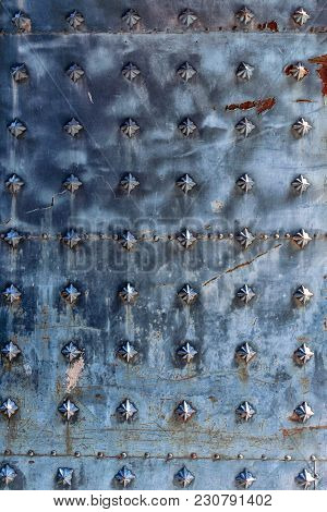 Texture Of A Metal Canvas Of An Old Forged Door.