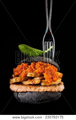 Italian Black Burger With Sausages Salamella , Potato And Vegetable Sauce. Plastic Fork