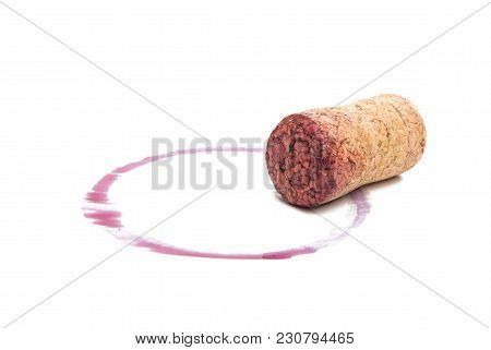 Wine Cork With Drops Of Red Wine Isolated On White Background