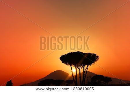 Beautiful Picturesque Orange Red Clear Sky Sunset Over Volcano Vesuvius Mountain Silhouette With Sun