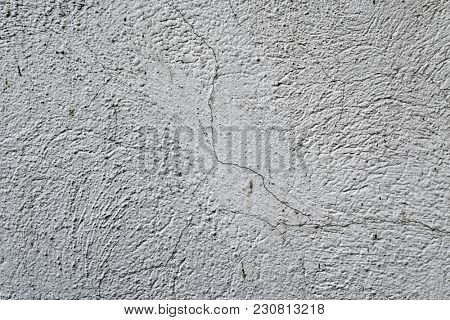 closeup of a rustic off-white plastered wall to be used as a background