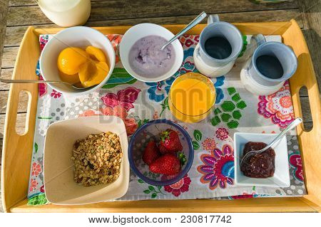 Top View Of Breakfast Tray With Healthy Meal Of Oats, Granola, Youghurt And Orange Juice