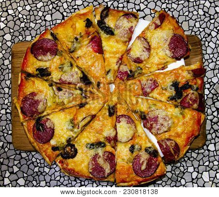 Delicious Top View Of A Pizza On A Wooden Board Against A Gray Texture Background