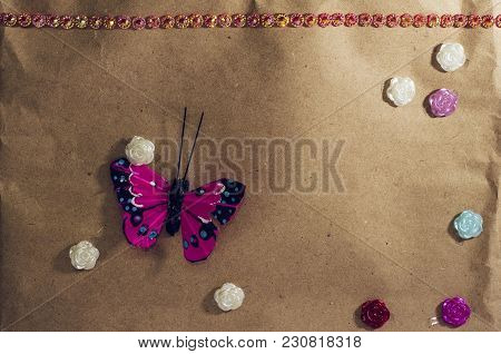 Background For Greeting Card On The Background Of Cardboard With Butterfly, Flowers And Rhinestones