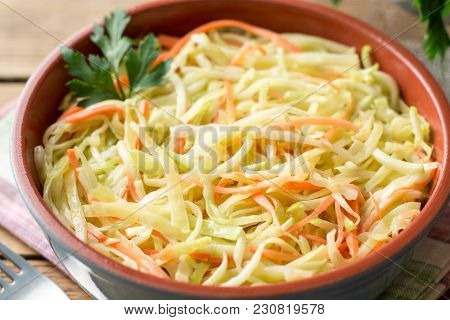 Fresh Coleslow Salad In Bowl On Rustic Wooden Table