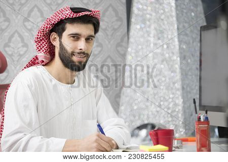 Arabian Business Man Working On Laptop In The Office.