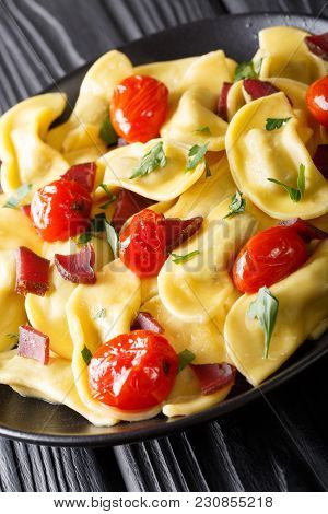 Delicious Italian Pasta Casoncelli With Ham Stuffing, With Cherry Tomatoes Close-up On A Plate. Vert