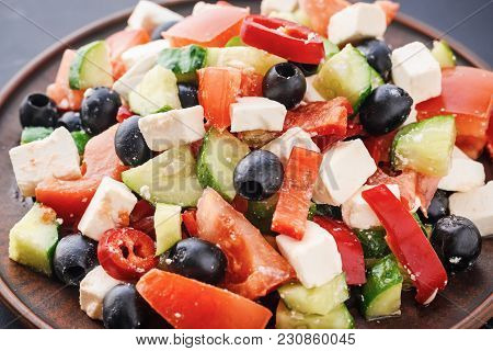 Greek Salad With Tomatoes, Feta And Olives Cllose Up. Vegetarian Healthy Food
