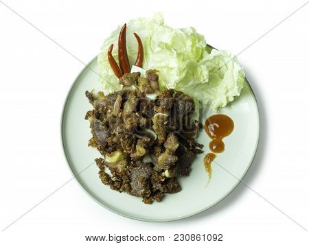 Fried Sour Pork, Fermented Pork With Sauce, Vegetable And Chili On Dish Isolated On White Background