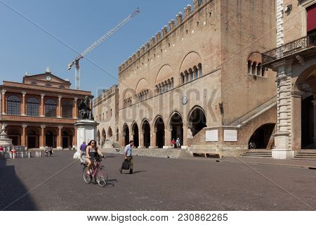 RIMINI, ITALY - JUNE 13, 2017: People on Piazza Cavour at the monument to Pope Paul V. The monument was installed here in 1614