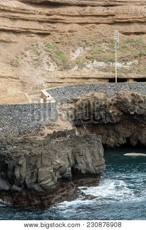 Cliff Along The Promenade In Porto Da Cruz On Madeira. Portugal