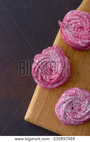 Top View Homemade Meringues On Oak Board With Copy Space