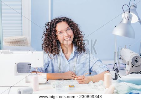 Cheerful Dressmaker Working With Lace At Workshop. Create Design. Beaded Embroidery