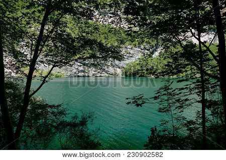 Photo View Of Molveno Lake In Dolomites Italy